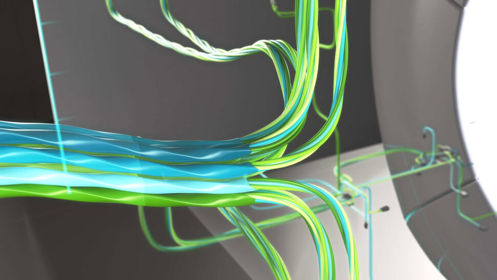 Cable bundle routing for medical imaging and treatment devices Closeup of cable bundle leading into an invisible medical device and branching out in the background